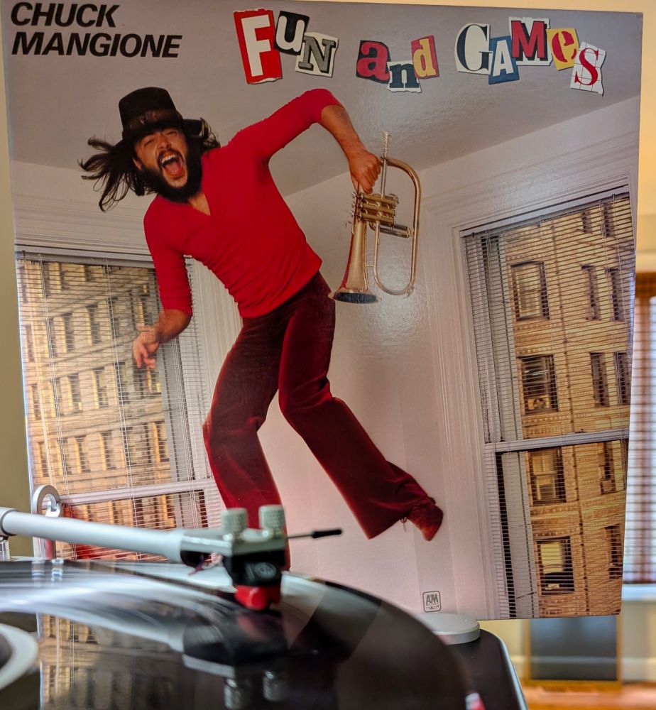 Chuck Mangione Fun and Games playing on VPI Scoutmaster turntable, Audio Technica AT-VM95ML cartridge
Album cover is of a laughing Mangione jumping on a trampoline in a city apartment, wearing red and burgundy, flugelhorn in hand.

Selection from Dad's Collection