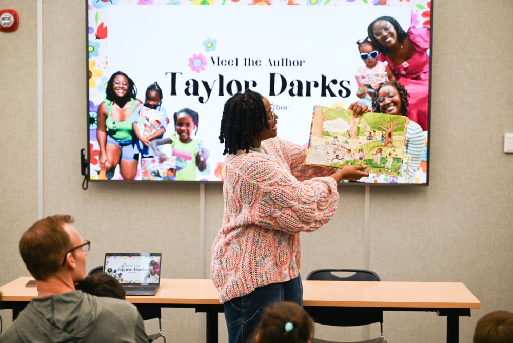 Author Taylor Darks reading her book at the Downtown Main Library.