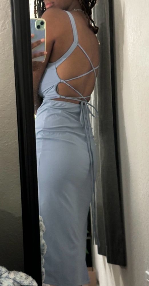 My flat ass in an ice blue dress.