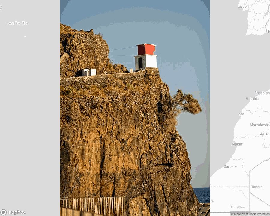 A photo of a lighthouse from the linked website, overlaid on a cropped world map where it's located.
