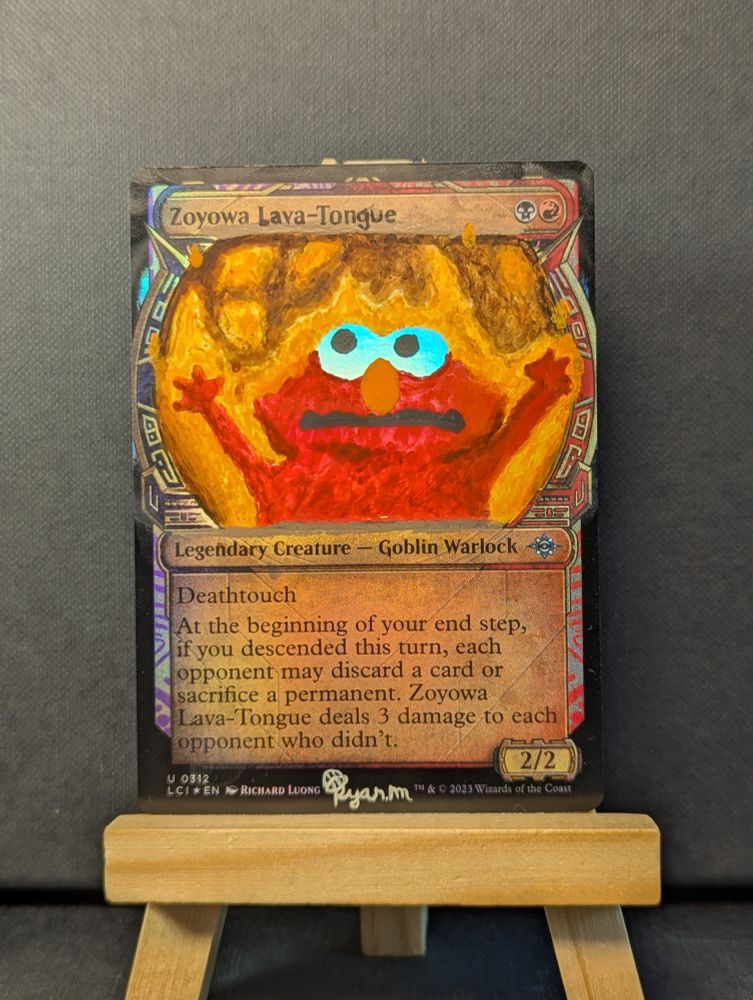 Zoyowa the goblin replaced with the flaming Elmo meme. The white of the eyes have no paint  so the foil reflects through them
