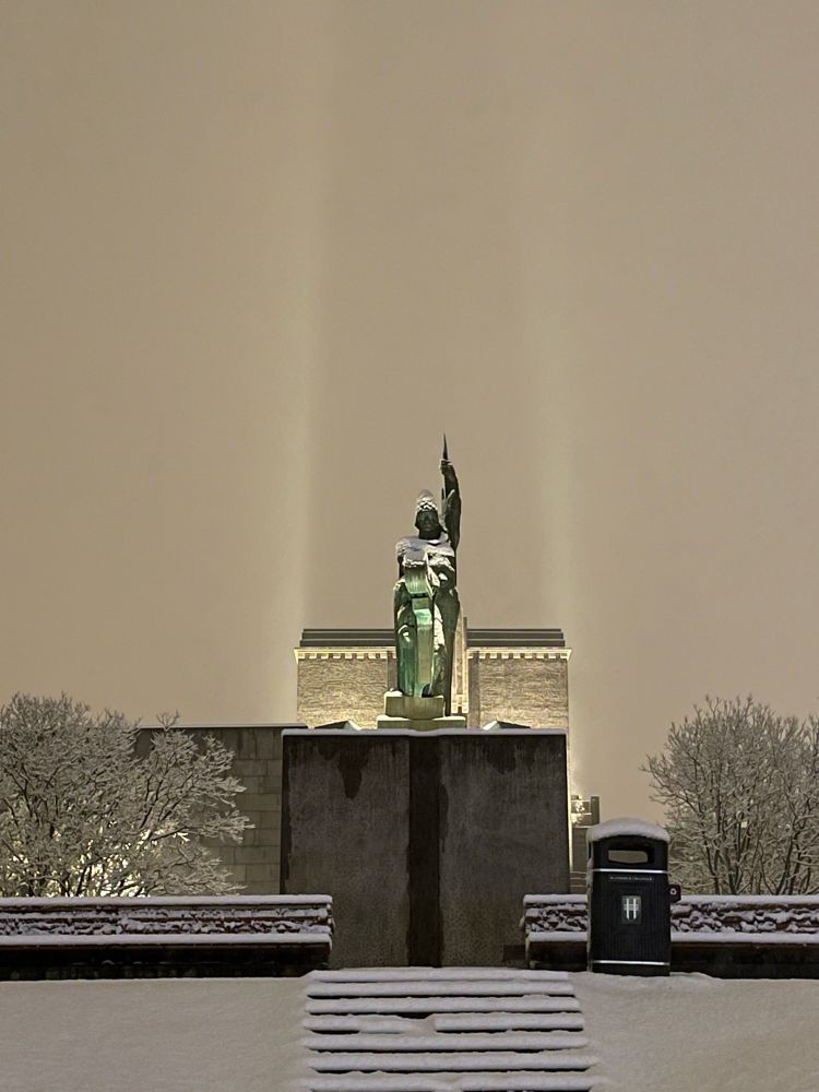 Snow-covered statue of Ingólfr Arnarson, the first settler of Iceland. Early morning.
