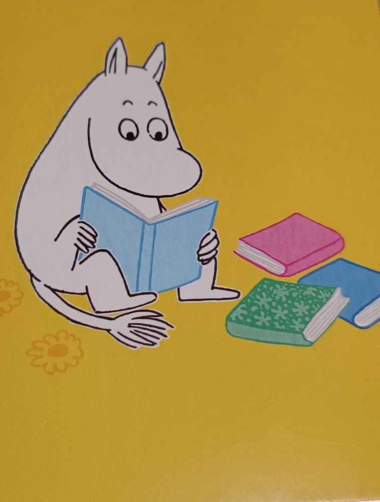 Moomin reading a heap of books