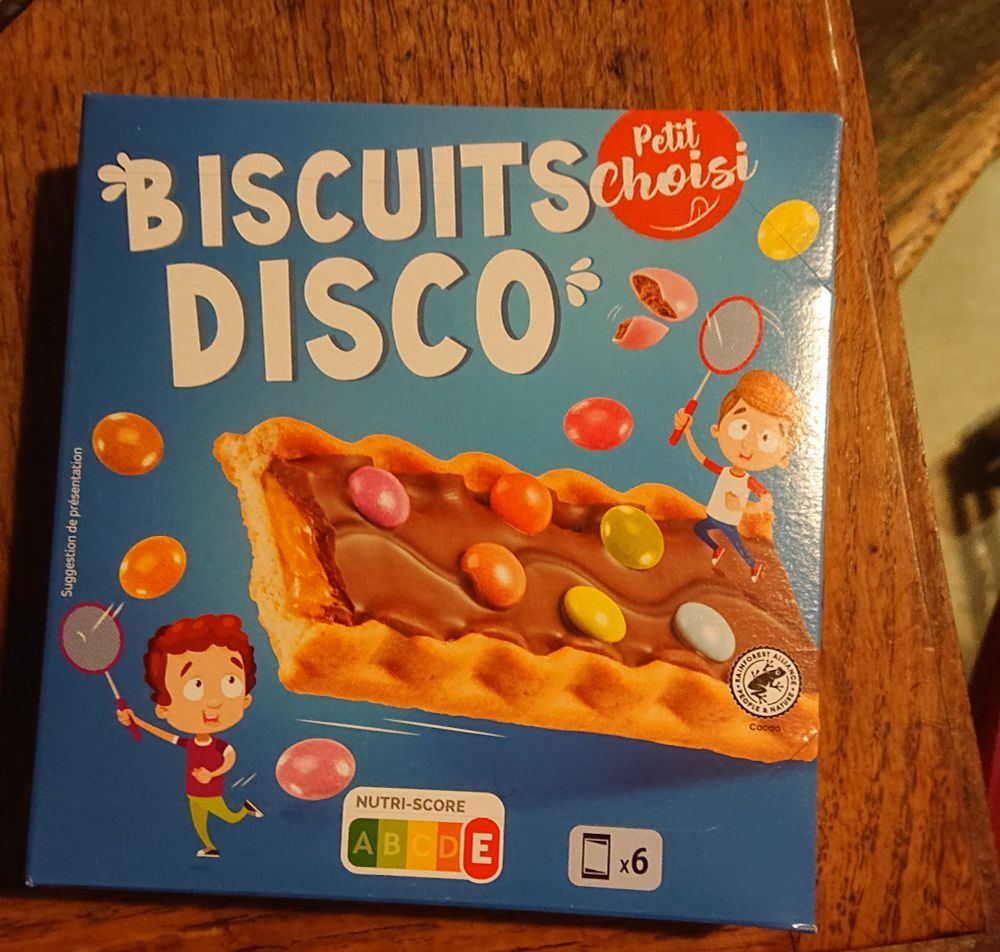 A picture of a packet of children's biscuits covered with chocolate, caramel and Smarties, branded 'Biscuits Disco'