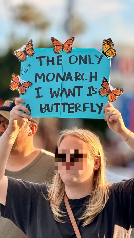 Protest sign: the only monarch I want is butterfly 
