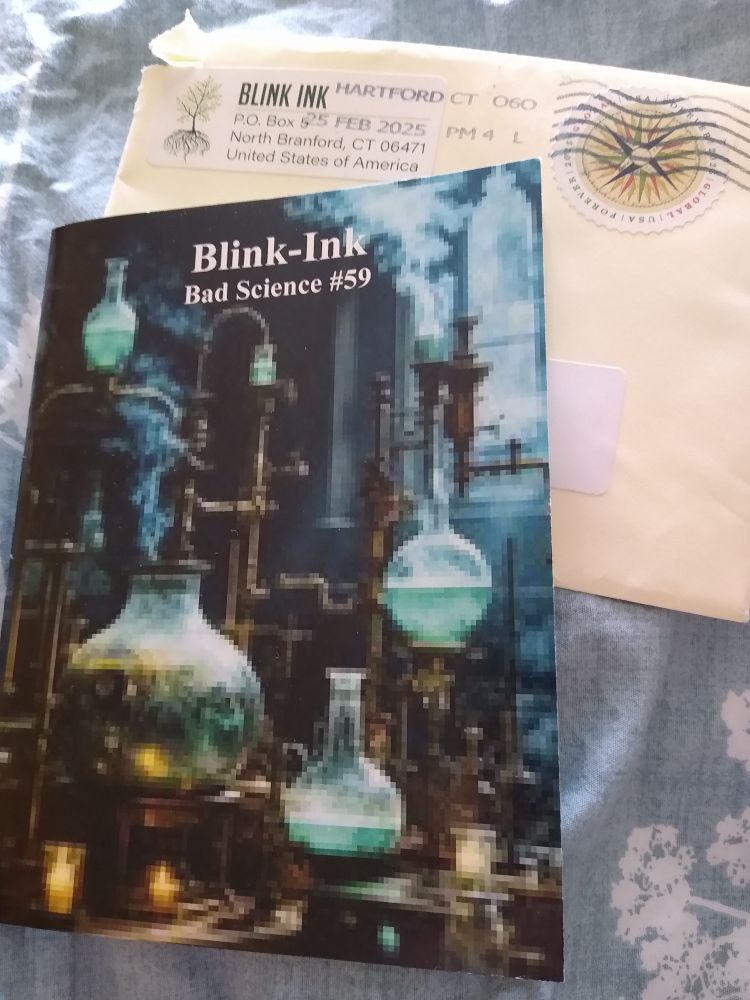A photo of tiny magazine, Blink Ink #59 and the envelope in which it arrived.