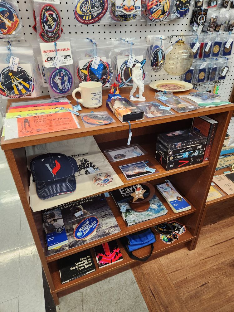 Photo of left side of antique mall booth that highlights various space collectibles.