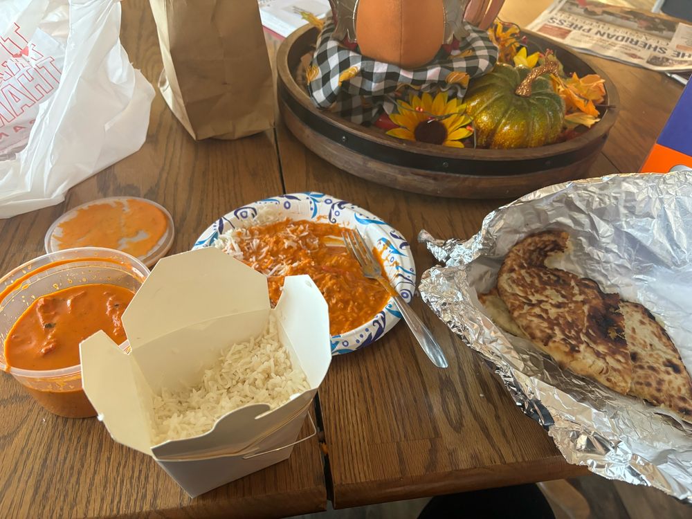butter chicken, rice, and cheese naan