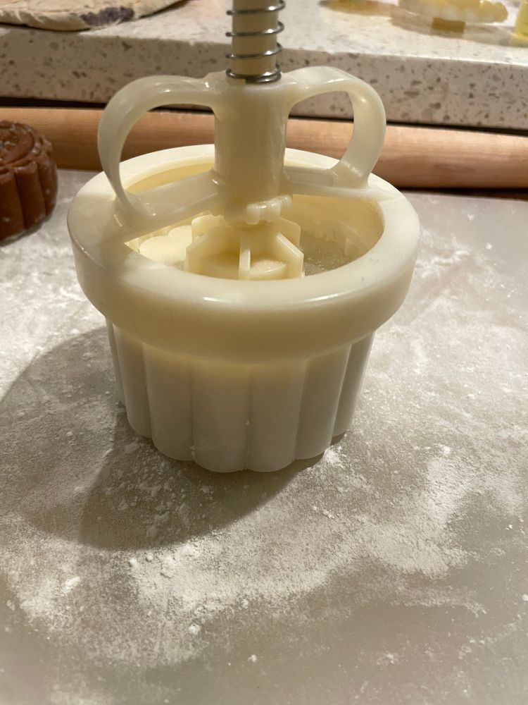 the mooncake mold with the mooncake within