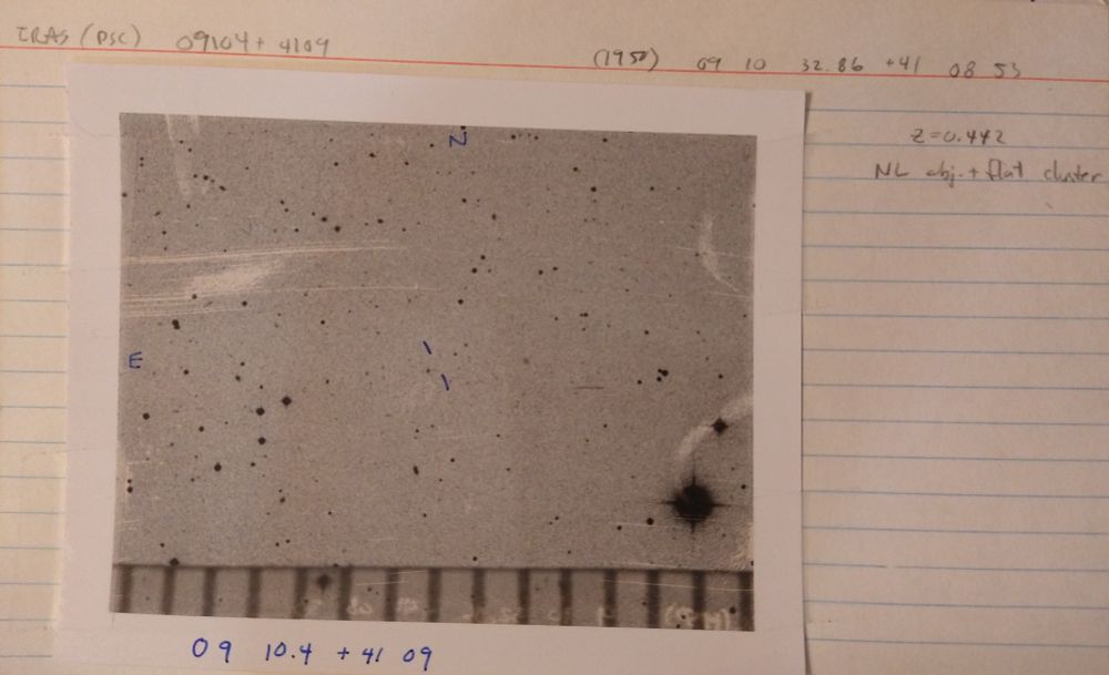 1980s-vintage finding chart for an infrared source (09104+4109) which proved to be the most distant IRAS galaxy known at that time. The image is a Polaroid copy of the Palomar Sky Survey photograph, with the edge of a transparent ruler giving a mm scale (1 mm =67 arcseconds).