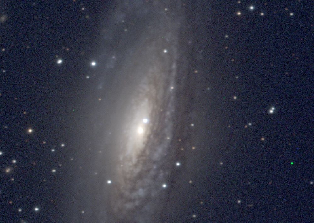 Spiral galaxy NGC 7331, seen highly inclined with feathery dust lanes augmenting the tightly-wound spiral pattern. Bright star above nucleus is type Ia supernova 2025rbx, discovered early this month.