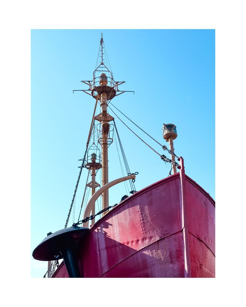 Sunlight on a red metal boat