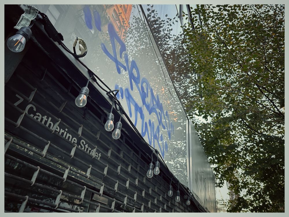 A closed dim sum restaurant on a tree lined street 