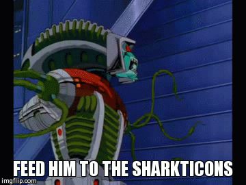 From Transformers the Movie. A Quintesson jury condemn a robot with orders to “feed him to the Sharkticons.”