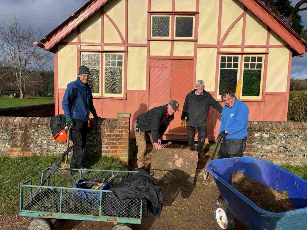 Four men working on a ramp outside Thame vicarage.