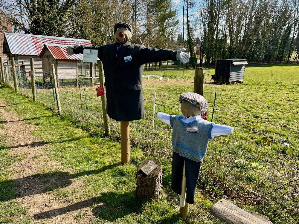 A father and son scarecrow in 1940s clothes