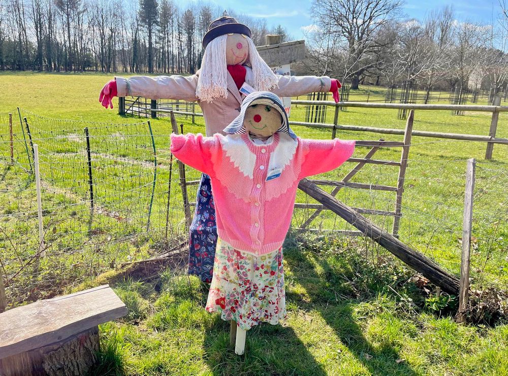 A mother and daughter scarecrow in 1940s clothes