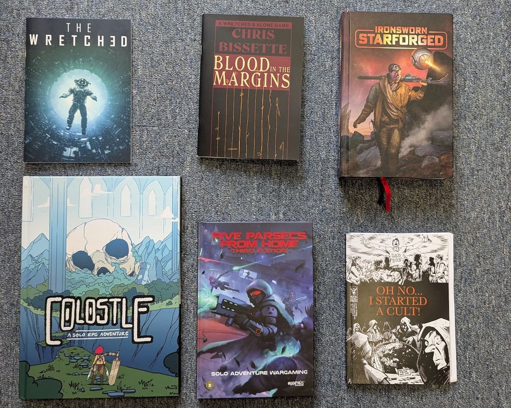 6 books for the solo rpg experience The Wretched Blood in the Margins IronSworn: Starforged Colostle Five Parsecs Oh No .. I Started a Cult.