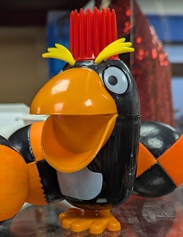 Plastic  penguin in a punk / exagerated cartoon style