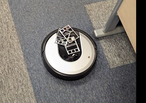 irobot vacuum cleaner with cutouts from boardgames
