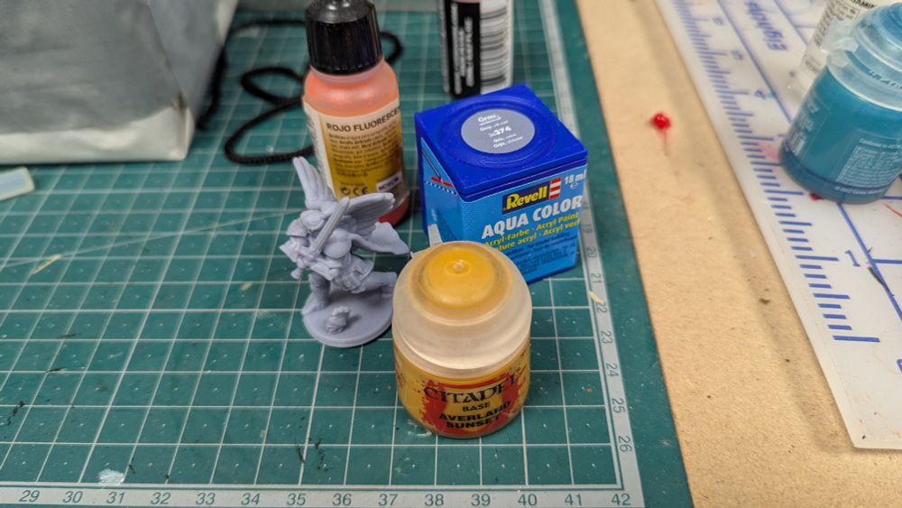 Paint pots near a miniature 