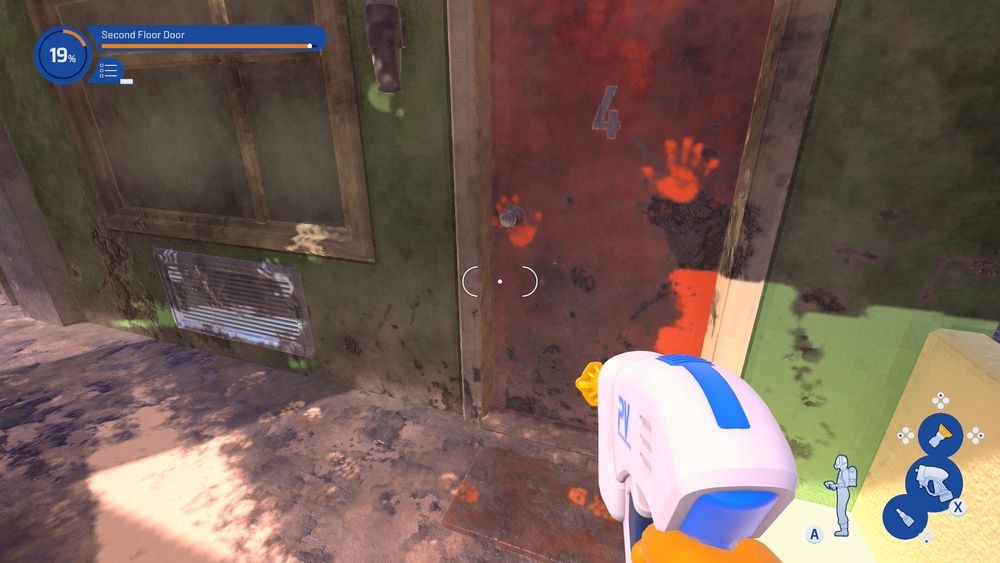 There is a dirty red door with handprints. 