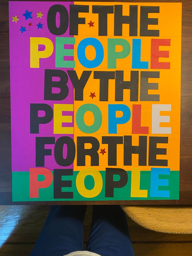 Poster reads 
OF THE
PEOPLE
BY THE
PEOPLE
FOR THE
PEOPLE