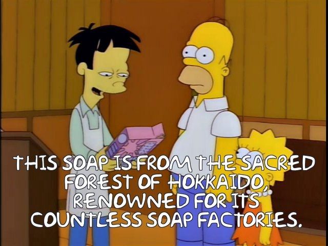 A screen shot of The Simpsons where Akira looks at a Mr Sparkle box and then tells Homer and Lisa, "THIS SOAP IS FROM THE SACRED FOREST OF HOKKAIDO, RENOWNED FOR ITS COUNTLESS SOAP FACTORIES."