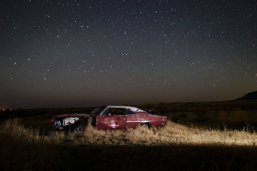 Derelict car under the stars