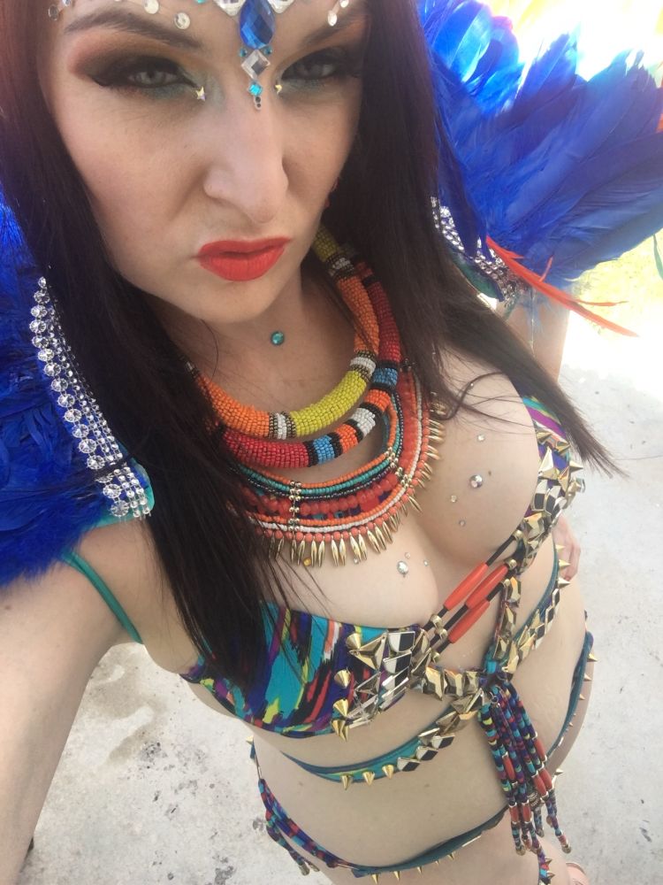 Girl in blue and orange carnival costume