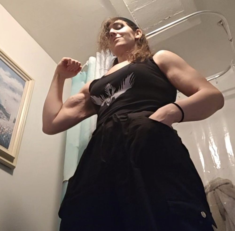 Me in a tank top flexing