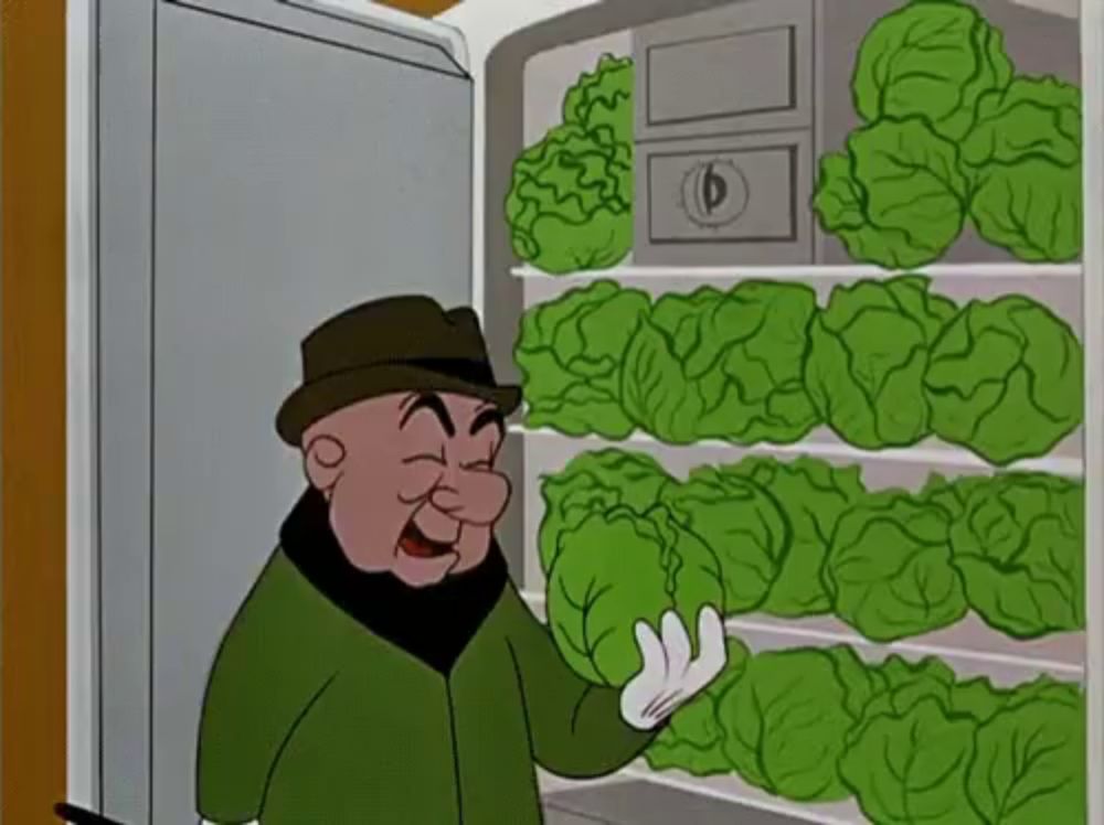 a cartoon character is standing in front of a refrigerator full of lettuce