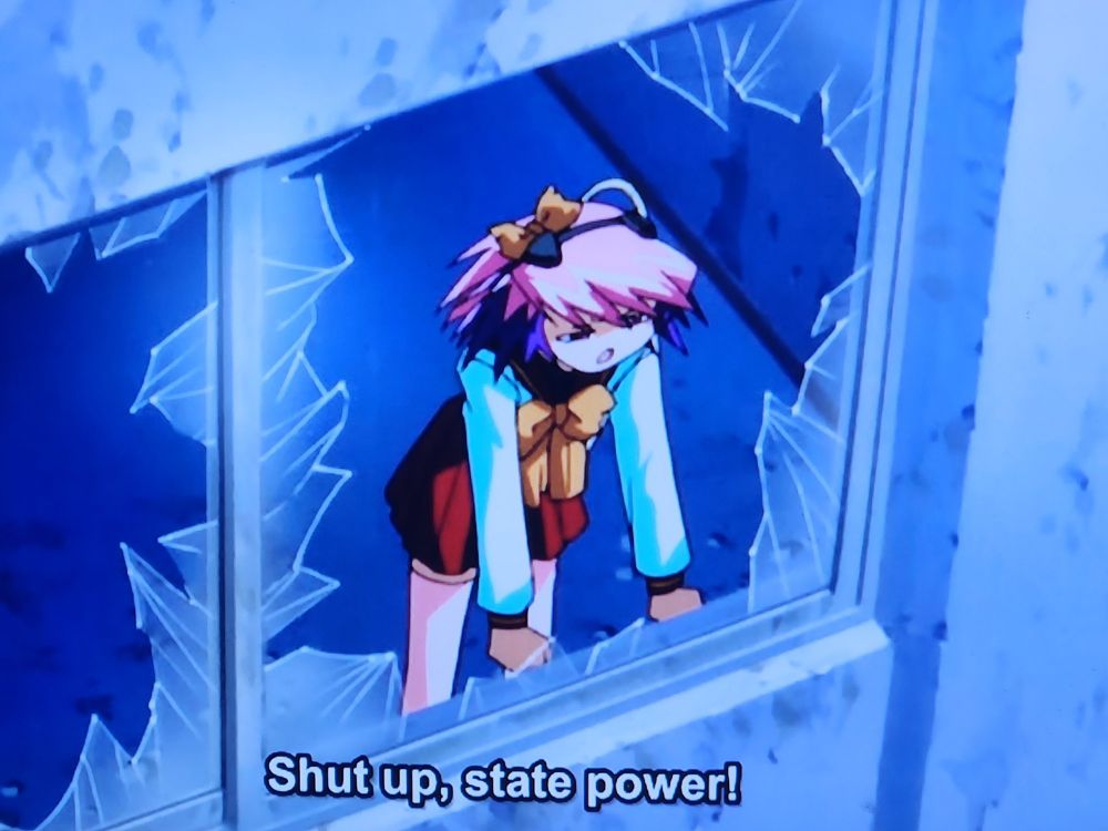 Ropponmatsu 2, from Excel Saga, yelling "Shut up, state power!" to the cops because she says ACAB!