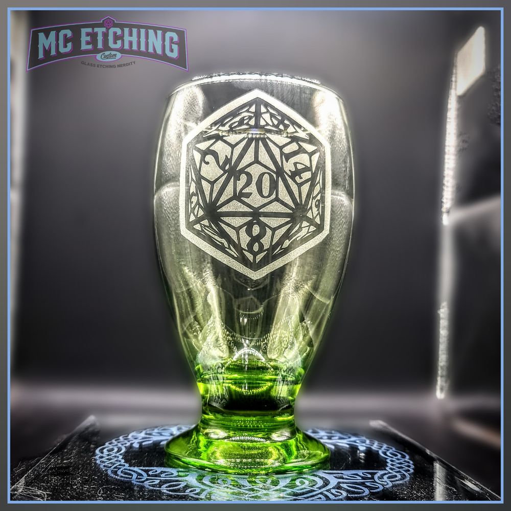10 oz green juice goblet etched with a stylized D20 design