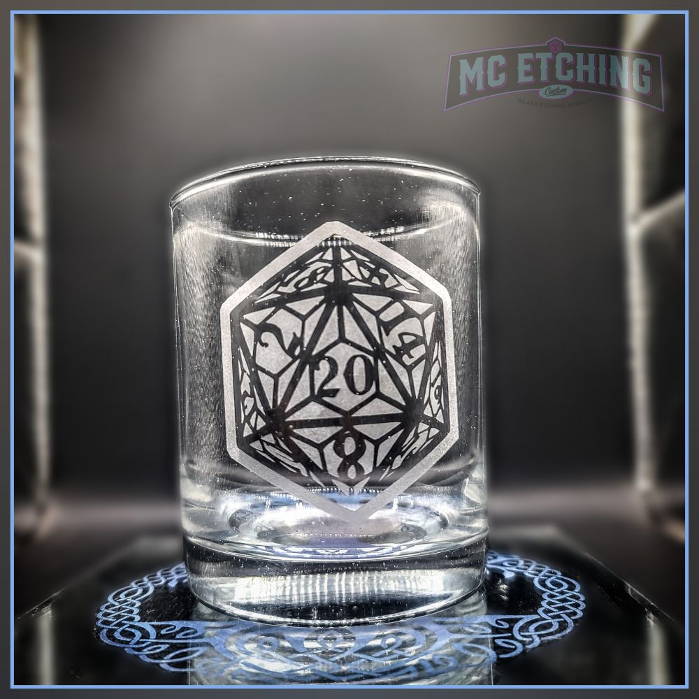clear Scotch glass etched with a stylized D20 design