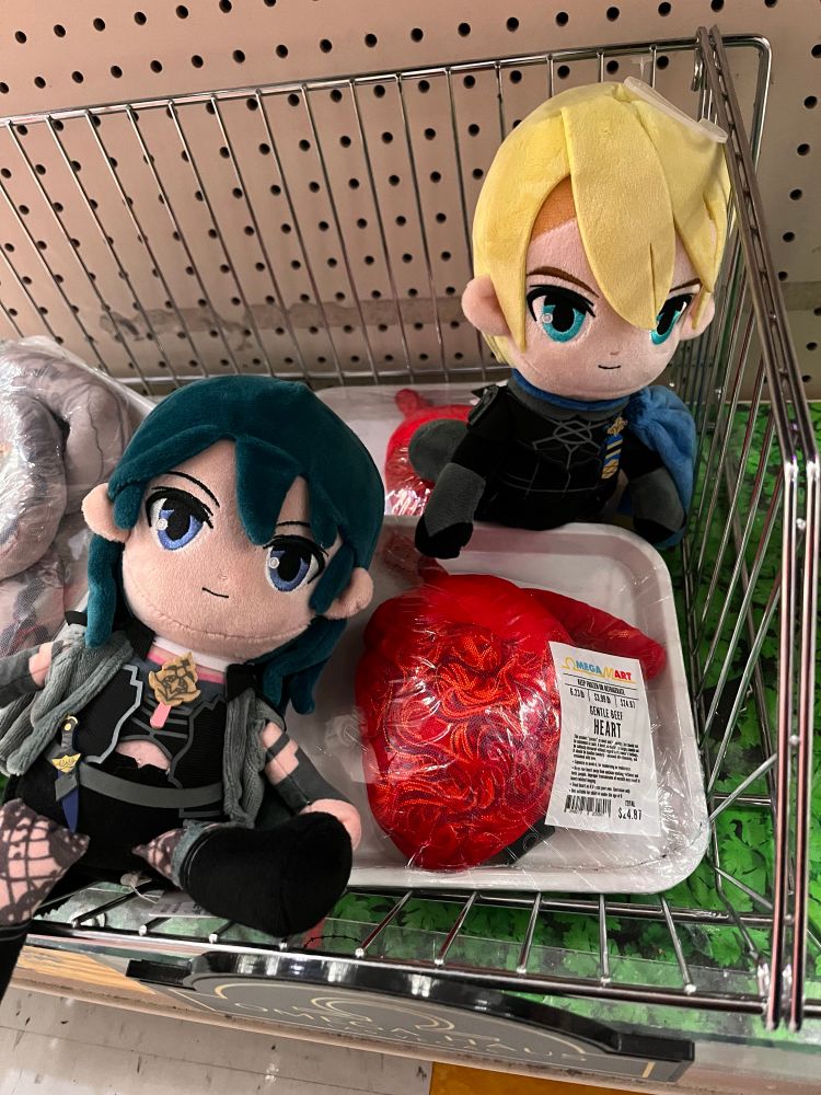 dimitri and byleth posing by a plushie human heart