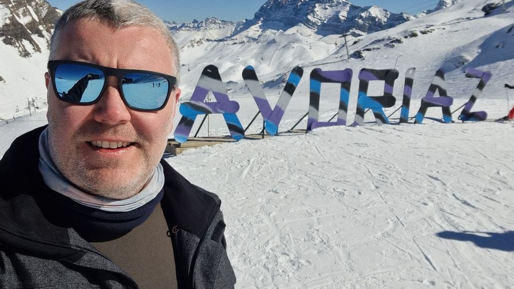 Me stood next to the Avoriaz sign, made out of old snowboards, at the top of one of the mountains.