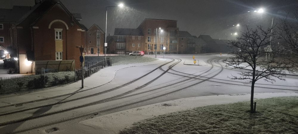 A dusting of snow on roads.