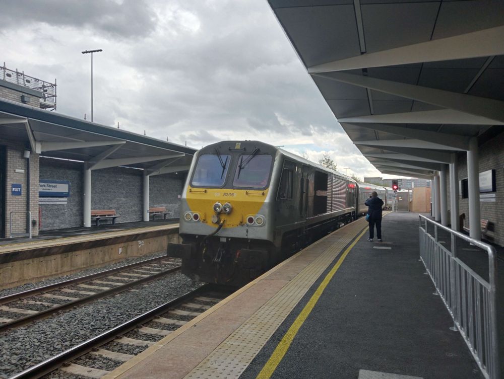 Enterprise train passing though Platform 2 under brand-new platform canopies.