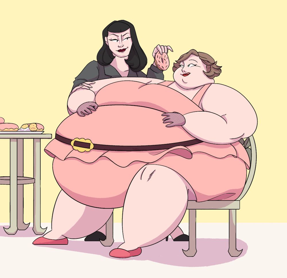 Rose (dark haired skinny woman with a mischevious smirk) is feeding a donut to Melba who's looking immensely large and sits on a chair as she's rubbing her belly and sticking out her tongue in excitement. 