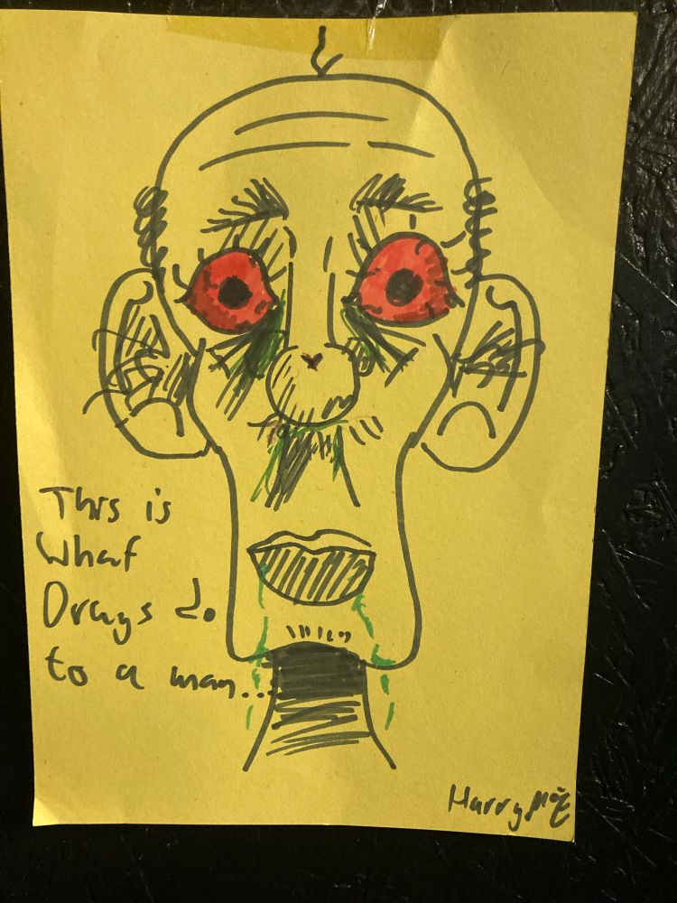 A marker pen sketch on yellow paper, of a bald, gaunt man with red eyes and an unkempt appearance.  A caption says “this is what drugs do to a man” and it is signed by Harry P7