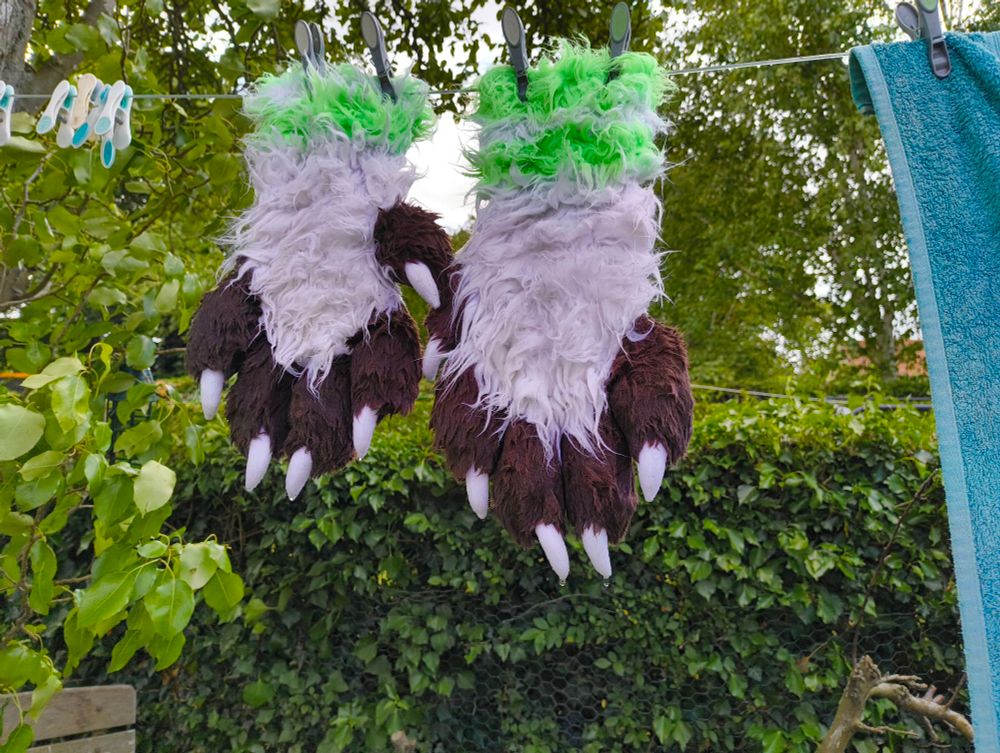 Fursuit handpaws drying outside