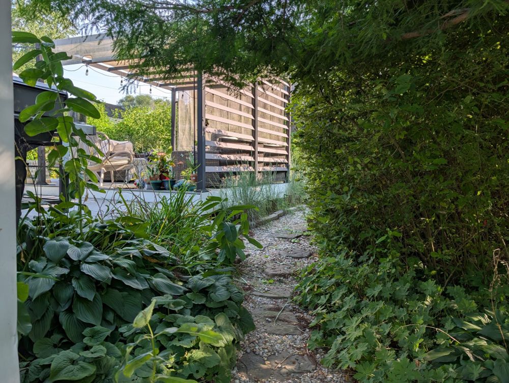 Gravel and flagstone garden path leading to deck and gazebo
