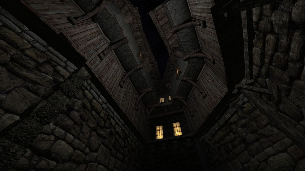 An alley cluttered by wooden buildings.
Screenshot by Matt