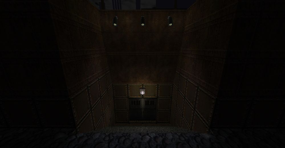 A brown metal building with a staircase leading to barred metal doors. 