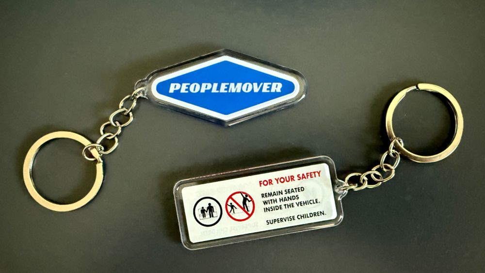 Disneyland-style PeopleMover logo and Safety Warning keychains.