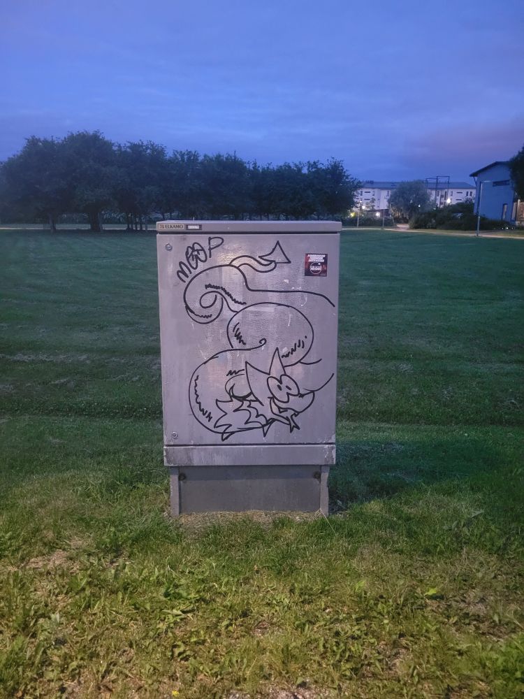 Graffiti of a wyrm-like thing on an electrical box