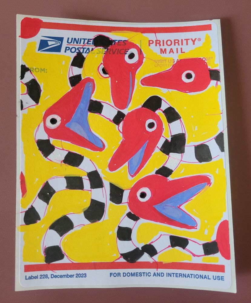 A posca pen illustration of red headed snake creatures on a USPS label