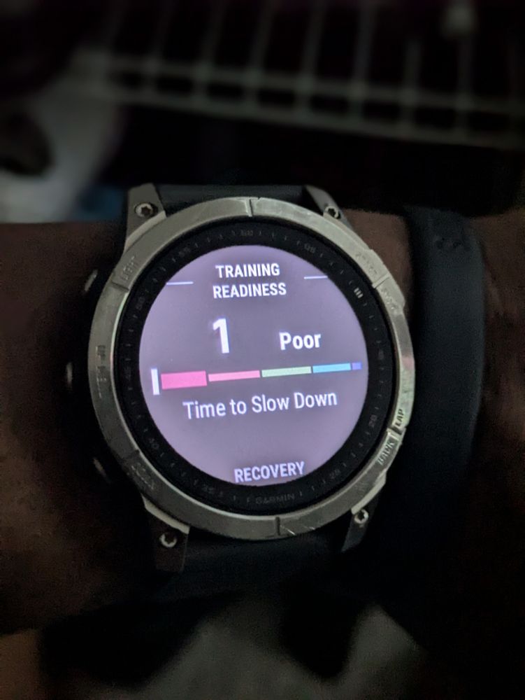 The face of a Garmin fénix 7 fitness smartwatch. The screen displays a training readiness score of 1. Training Readiness scores range from 1 to 100.