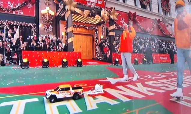 A tiny float being pulled by a toy truck in the Macy parade